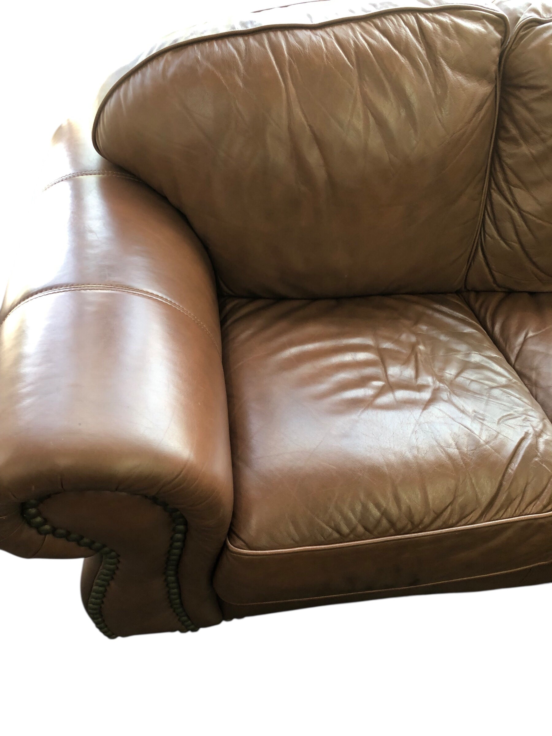 Light brown leather loveseat