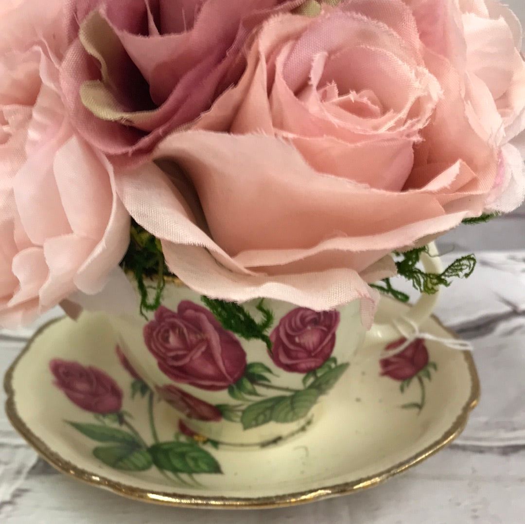 Teacup with pink/purple flowers