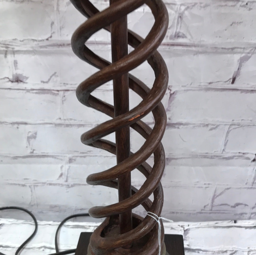 Lamp with twisted base