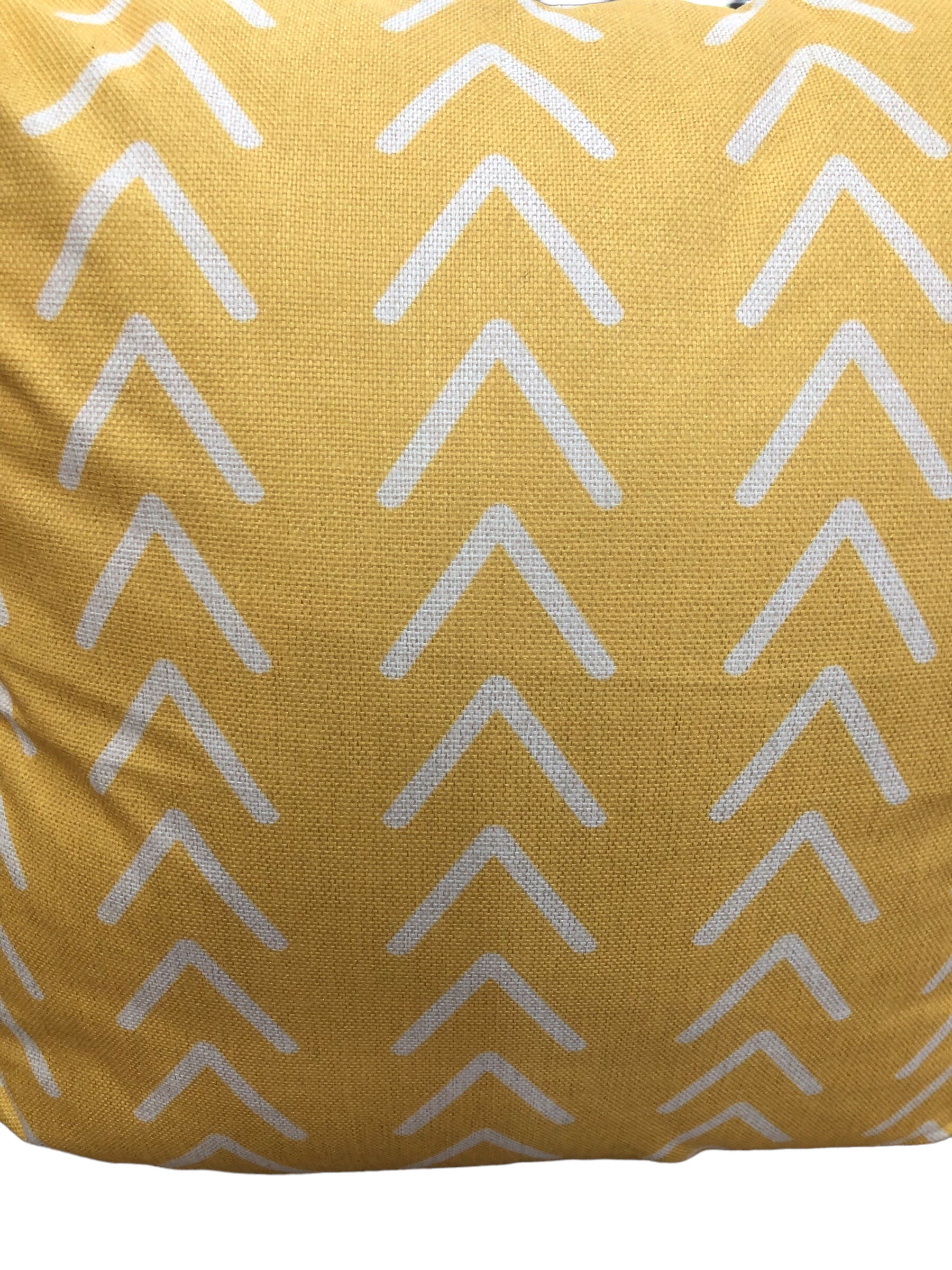 Yellow/Cream pillow with arrows